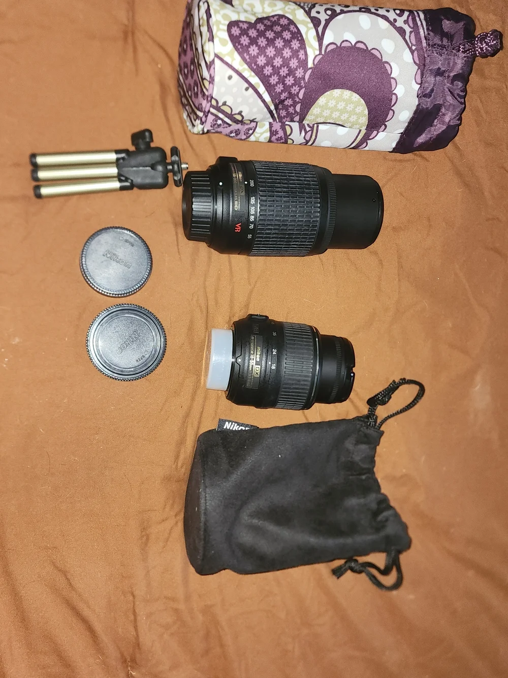 Nikon black DSLR Camera Body with Two Black Zoom Lenses